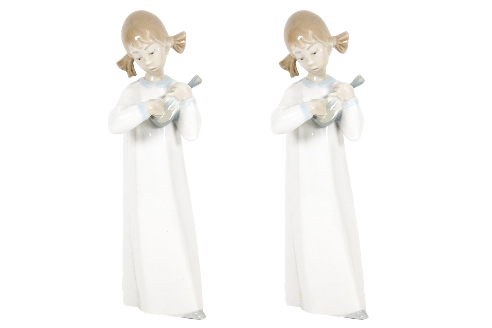 2 Lladro girl figurine: 2 Lladro girl figurine. H: 8" x W: 2.75."