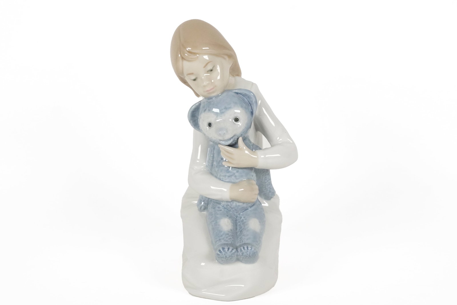 Lladro girl with bear: Lladro girl with bear figurine. H: 6.2" x W: 4.25."