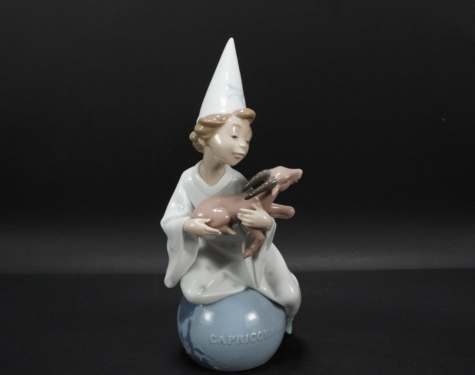 Lladro boy with goat: Lladro boy with goat figurine. H: 9.25" x W: 4.25."