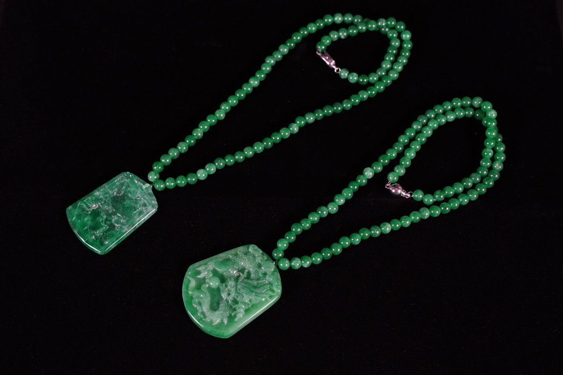 2 Chinese jadeite pendants: 2 Chinese fine jadeite carved pendants.