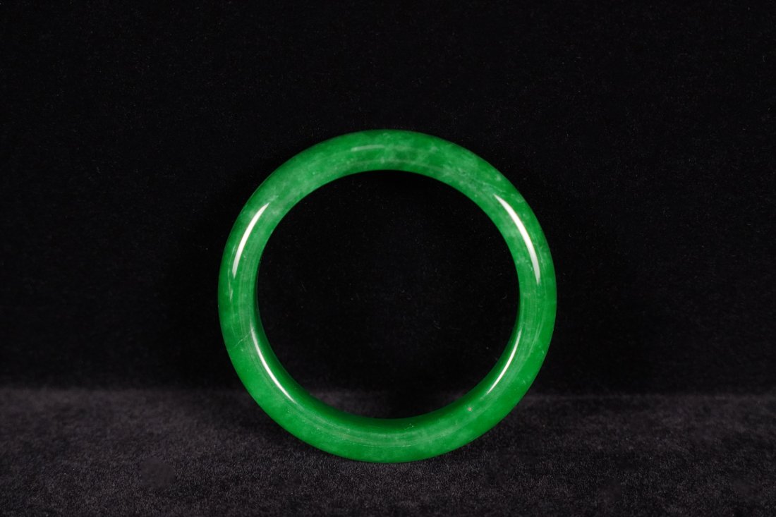 Chinese apple green bangle: Chinese apple green jadeite bangle.