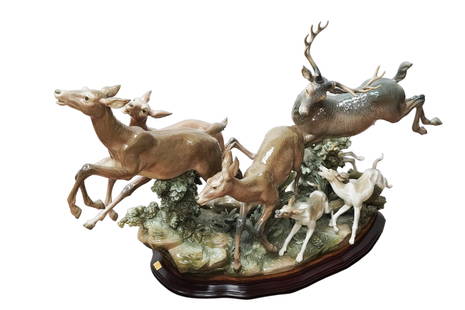 A rare Lladro large figurine: A rare Lladro large deer figurine, with original wooden base. Bottom is signed. A retired collection. H: 20" x W: 47." In good condition, no repair.