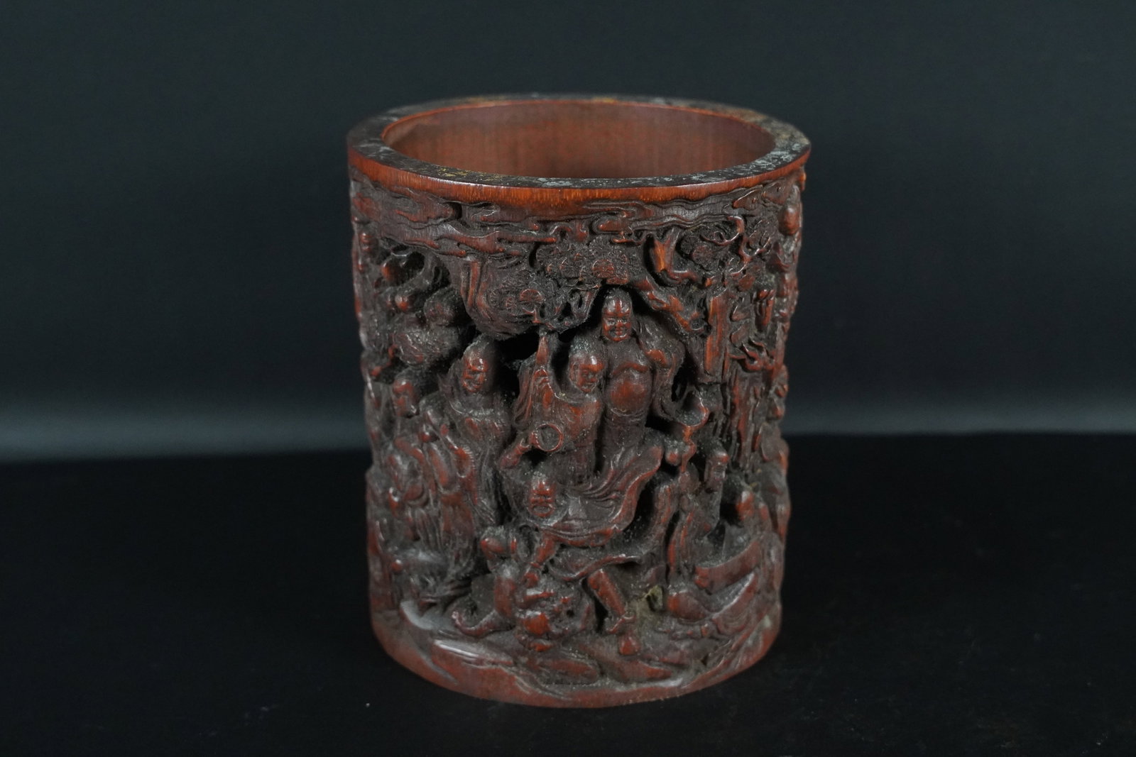 Chinese fine brush pot: Chinese fine brush pot with carvings. H: 6.25" x W: 5.5."