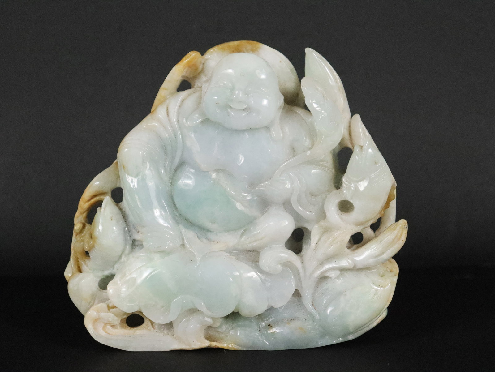 Chinese jadeite happy buddha: Chinese jadeite carved happy buddha. H: 4.25" x W: 5."