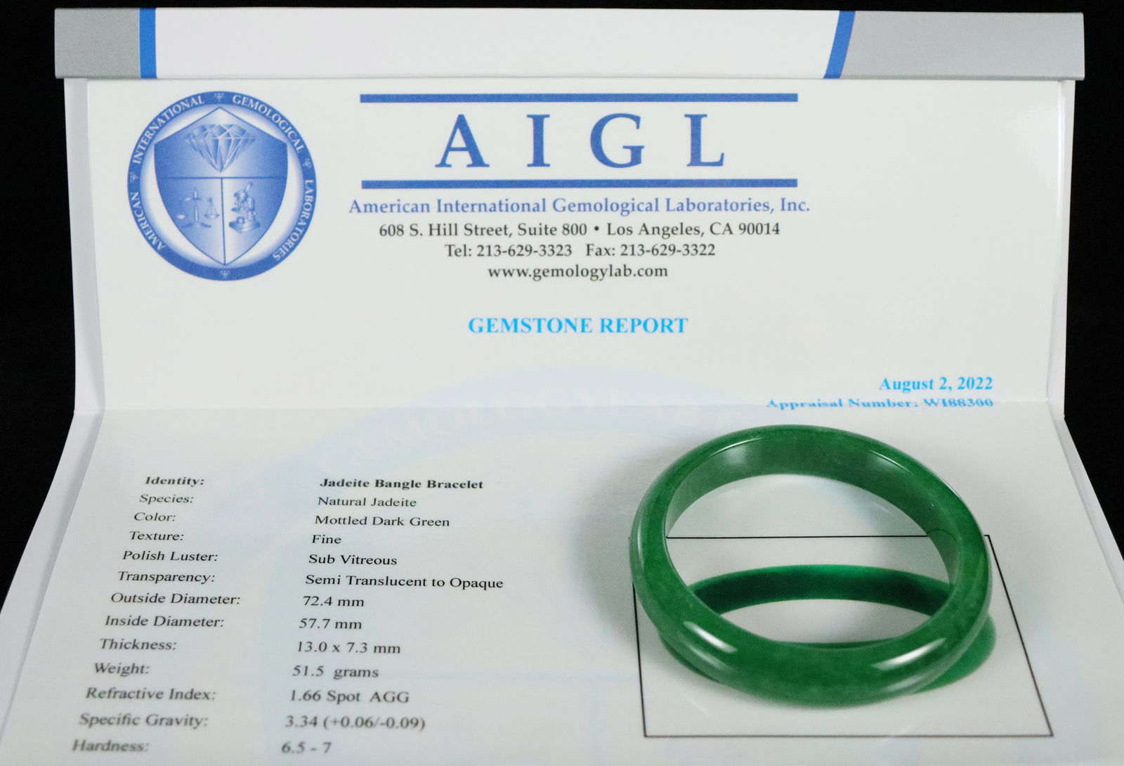 Chinese apple green bangle: Chinese apple green jadeite bangle.