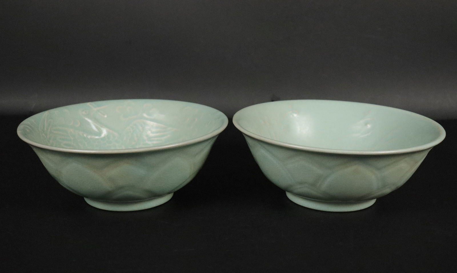 2 Chinese celadon bowls: 2 Chinese celadon bowls with wax seal. H: 2.75" x W: 7.25."