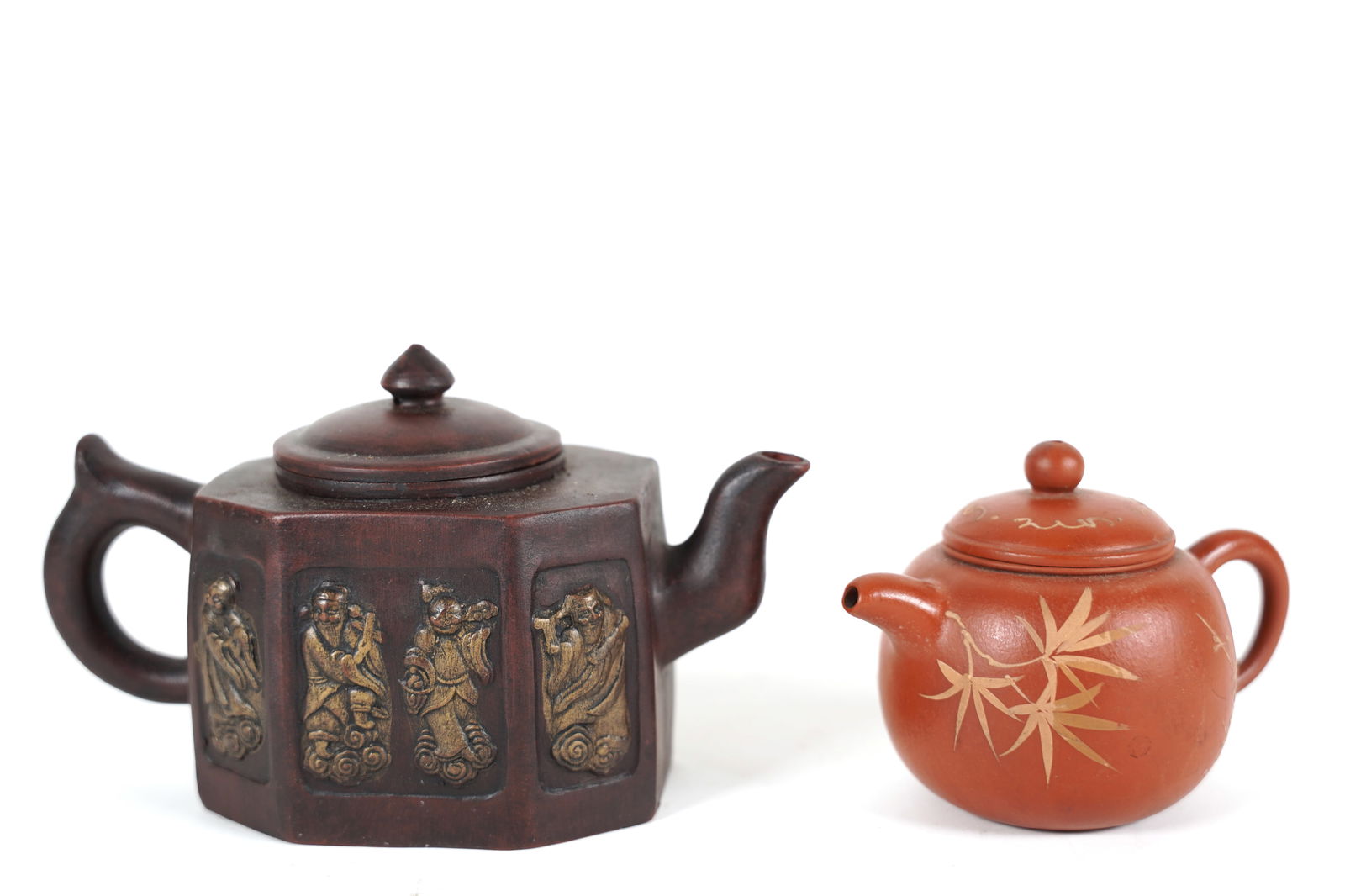 2 Chinese clay teapot: 2 Chinese fine clay teapot. Largest H: 4.5" x W: 7."