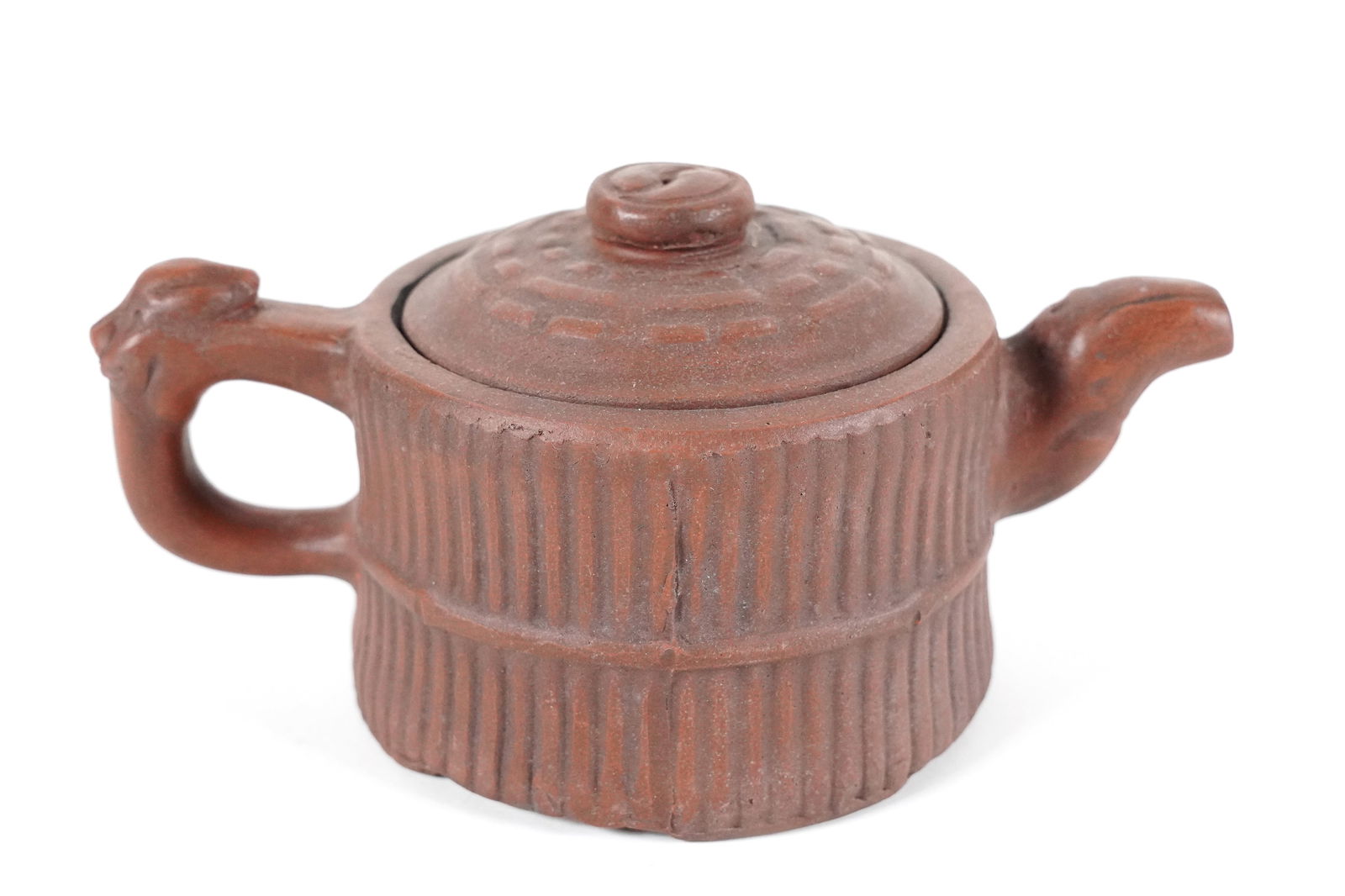 Chinese clay teapot: Chinese fine carved clay teapot. H: 3.2" x W: 6.75."