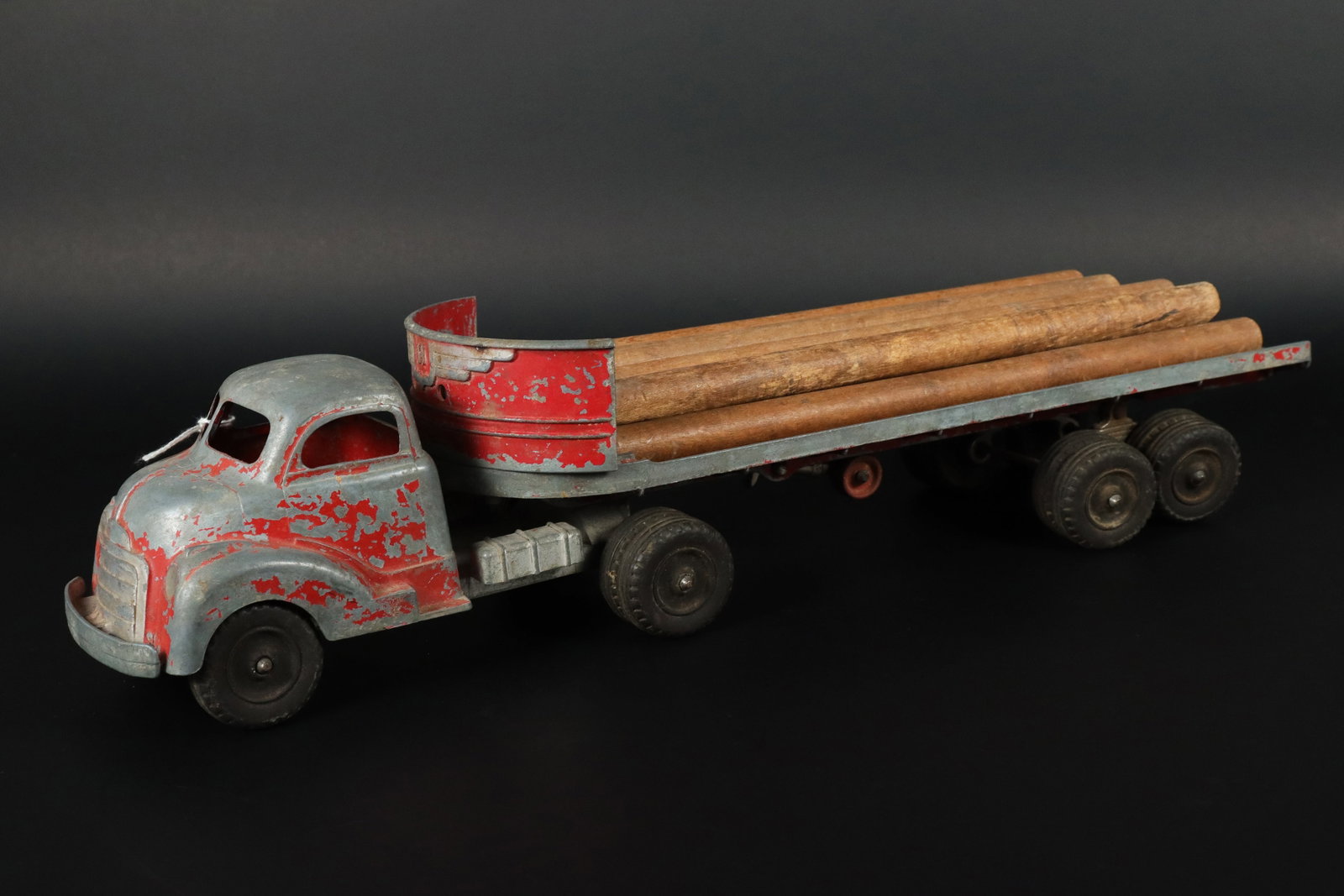 Hubley log truck: Hubley log metallic vintage truck. H: 4.25" x W: 17.5."