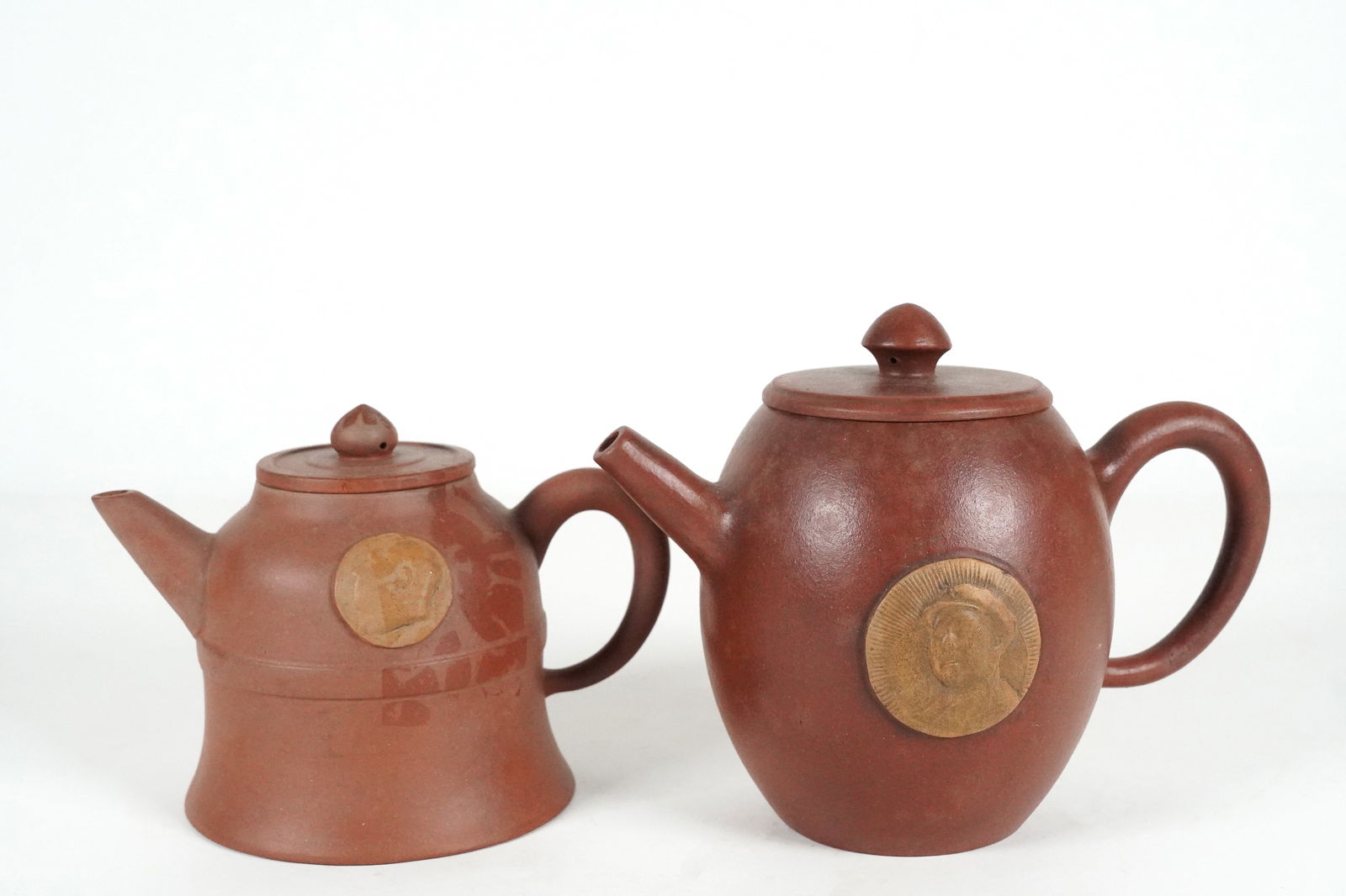 2 Chinese clay teapot: 2 Chinese clay teapot. Largest H: 5.5" x W: 7.1."