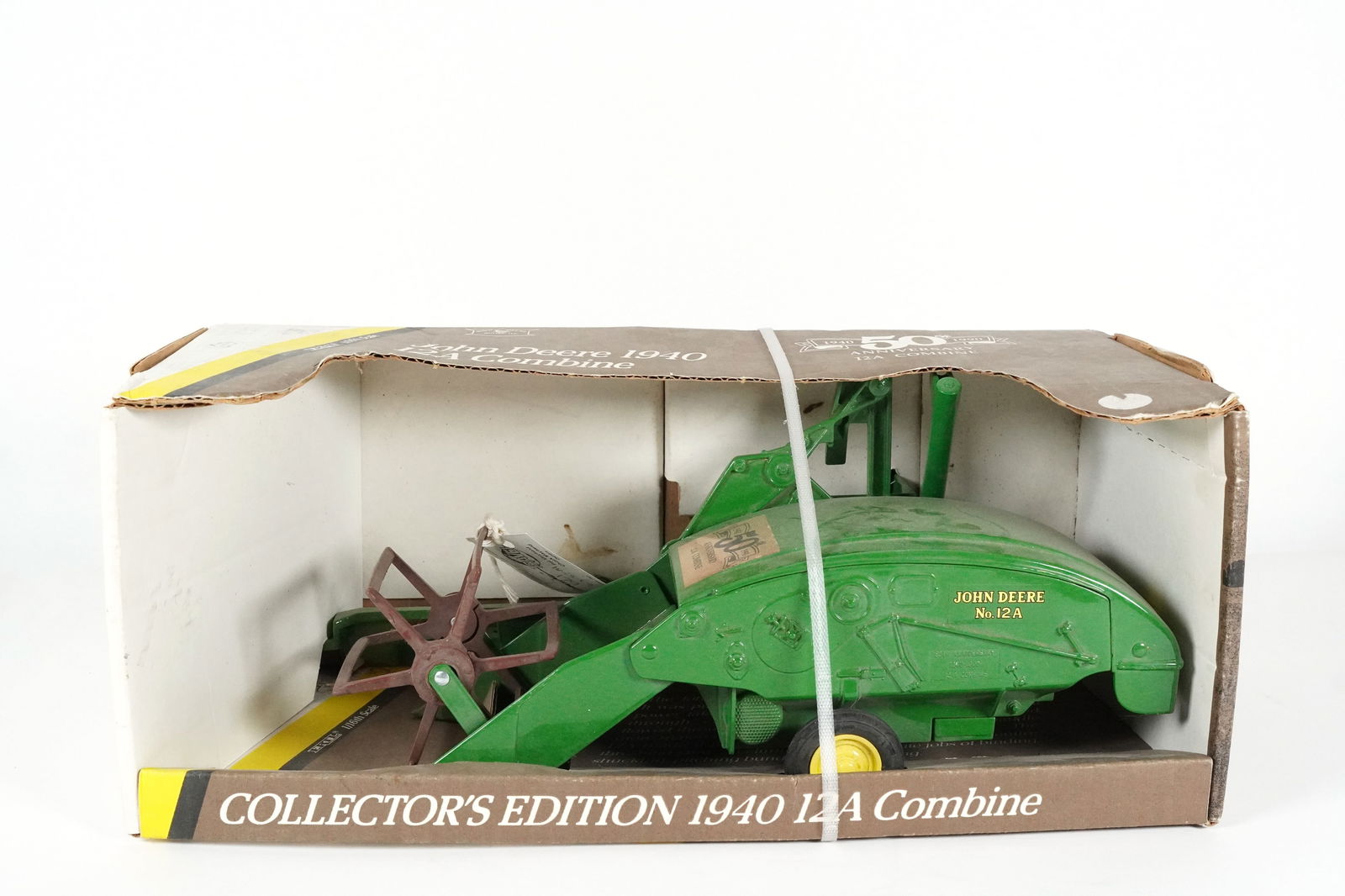 A John Deere truck: A John Deer truck in original box. H: 15.75" x W: 9.75."