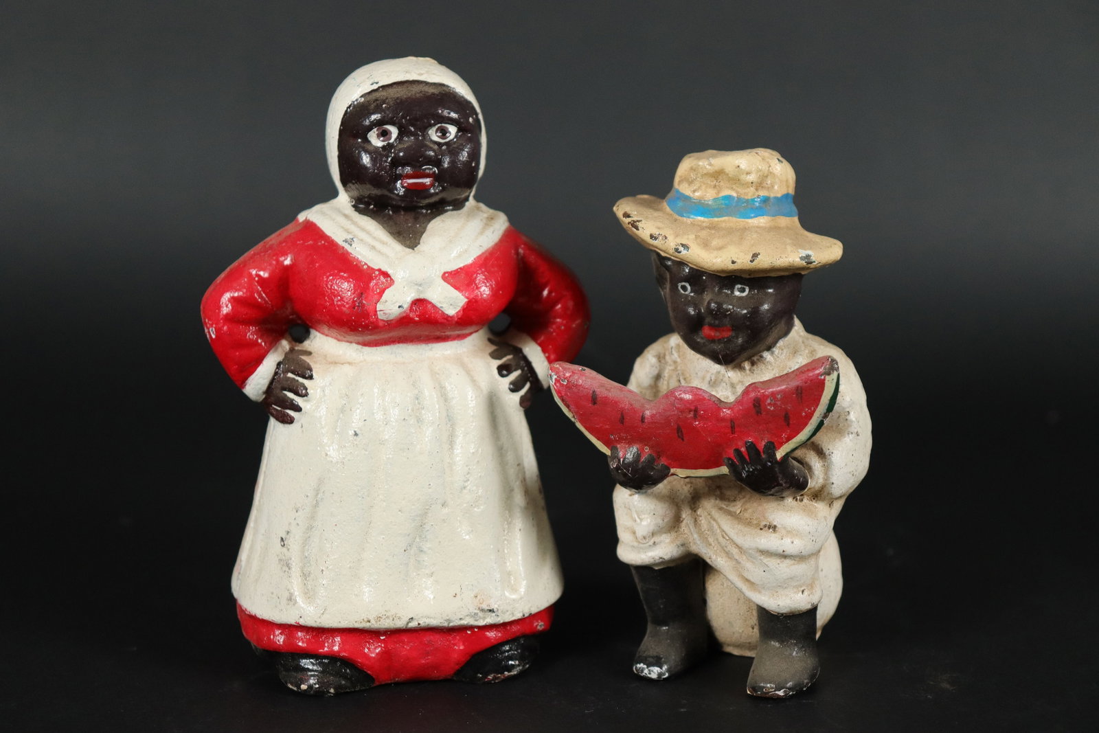 2 Black Americana bank: 2 Black Americana cast iron bank. Largest H: 5.5" x W: 3.5."