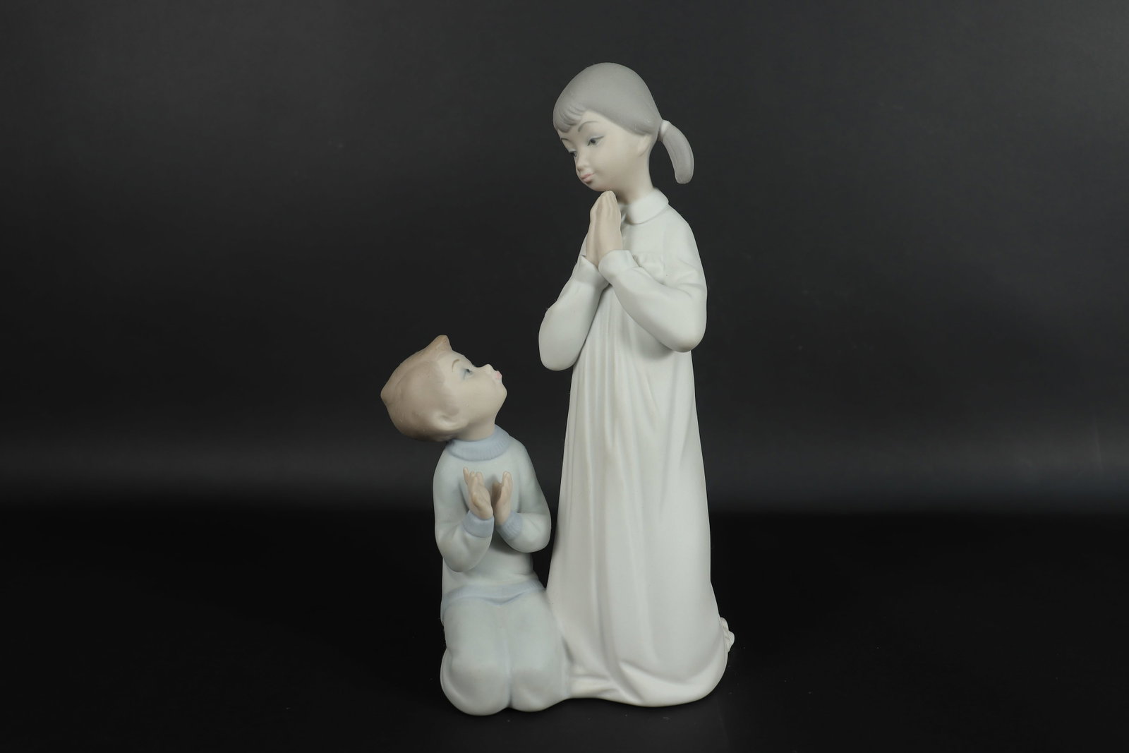 Lladro children figurine: Lladro children figurine. H: 8.75" x W: 4.25."