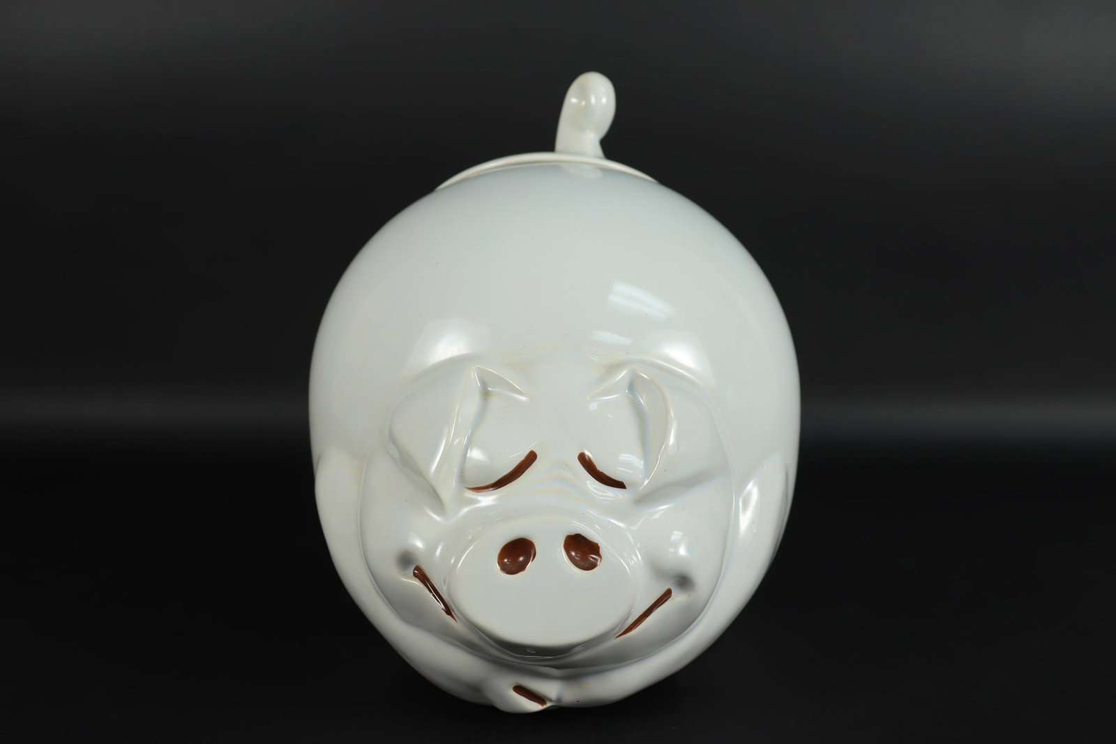 A vintage piggy cookie jar: A vintage piggy cookie jar. H: 10" x W: 8."