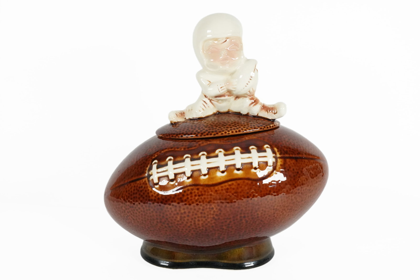 McCoy football cookie jar: McCoy football cookie jar. H: 12" x W: 11."