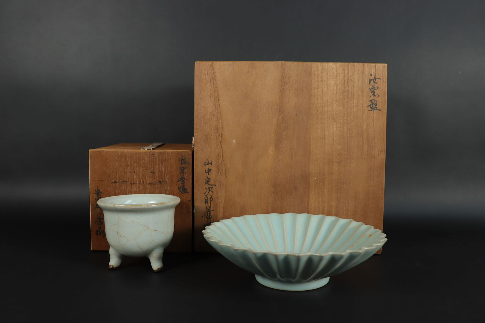 2 Chinese celadon porcelains: 2 Chinese fine celadon porcelains, comes with wooden storage box. Largest H: 9.5" x W: 9.5."