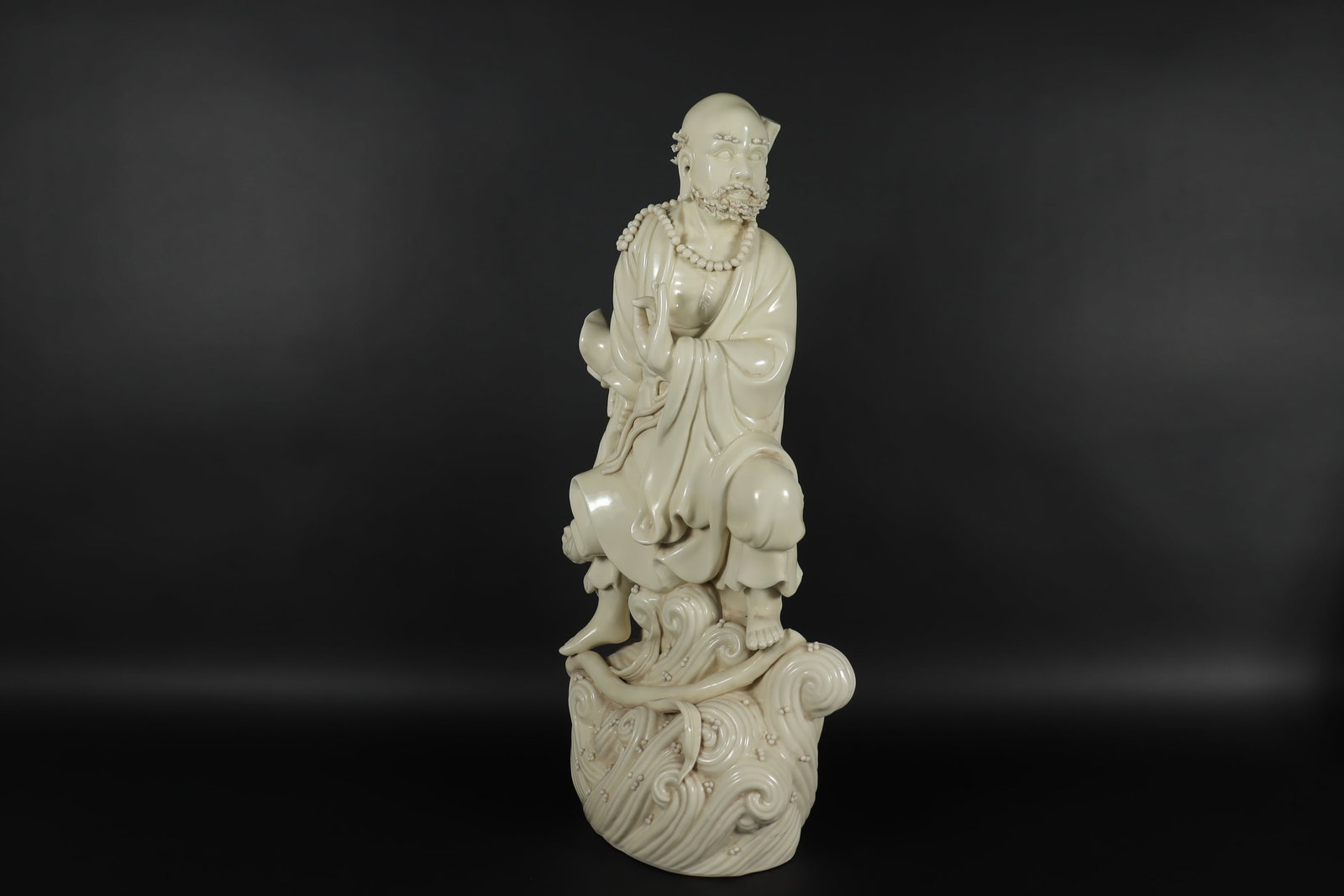 Chinese white fine statue: Chinese white fine statue, side chipped, condition selling it as is. H: 17.25" x W: 9."