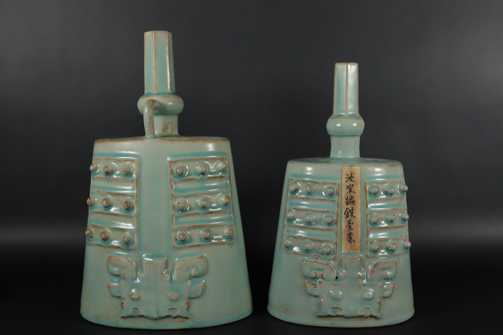 2 Chinese porcelain bells: 2 Chinese porcelain bells. Largest H: 12.25" x W: 6.5."