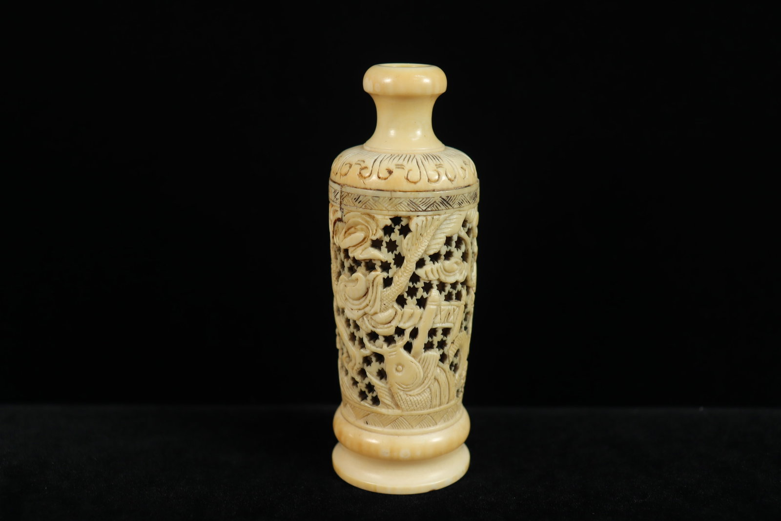 Chinese fine bone carved vase: Chinese fine bone carved hollow antique vase. H: 4" x W: 1.5."