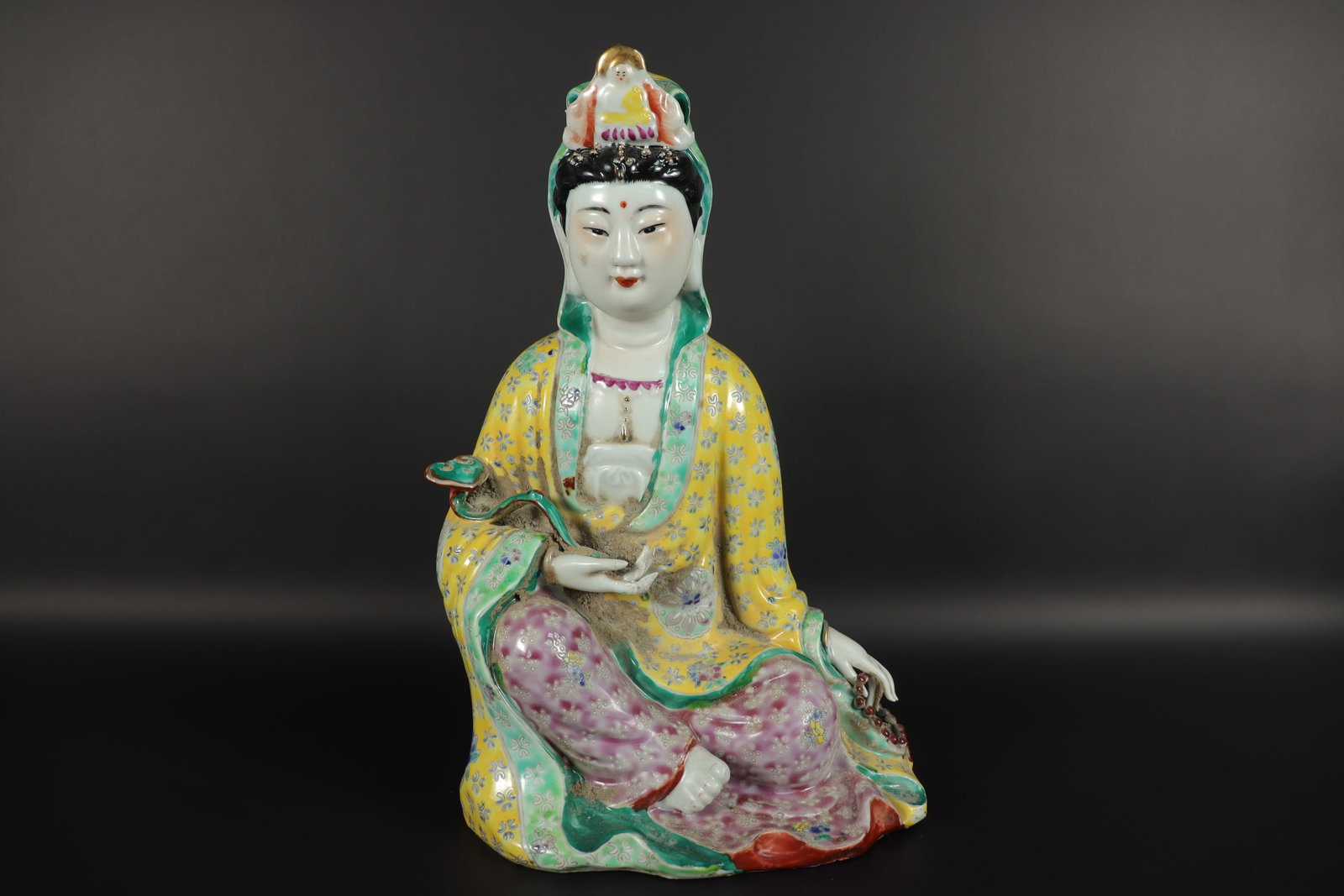 Chinese famille rose statue: Chinese famille rose porcelain statue, in form of a buddha. H: 12.25" x W: 8."