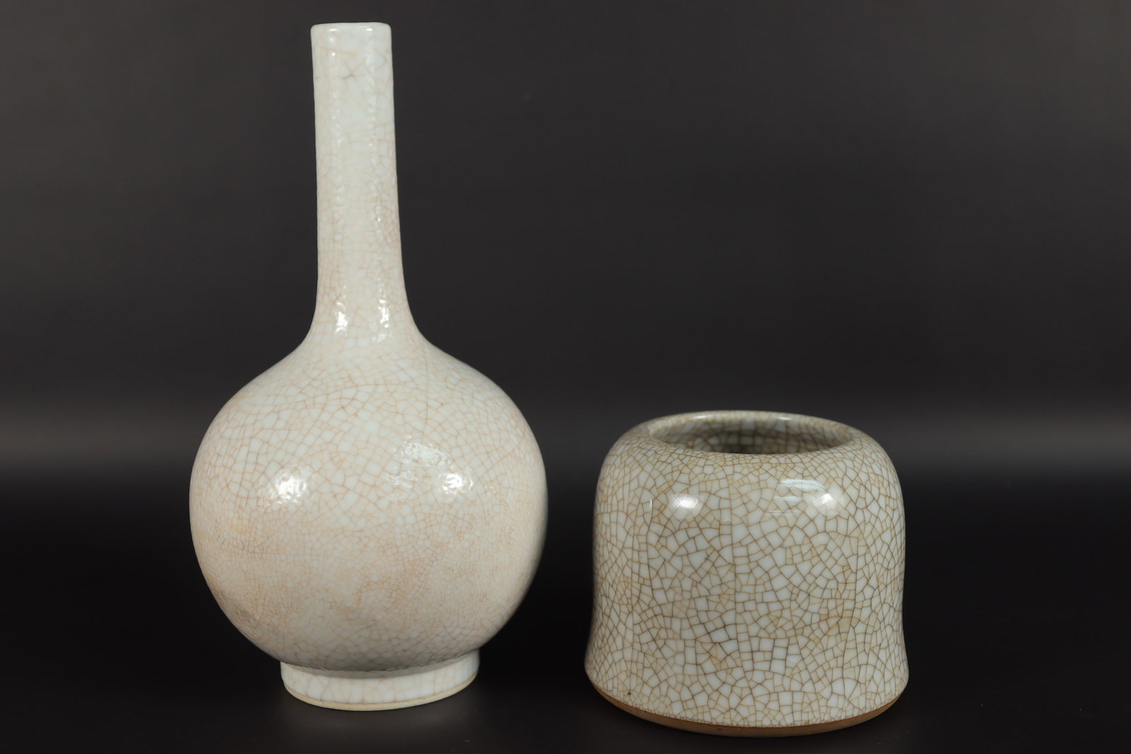 2 Chinese crackled porcelains: 2 Chinese fine crackled porcelains. Largest H: 9" x W: 4.5."