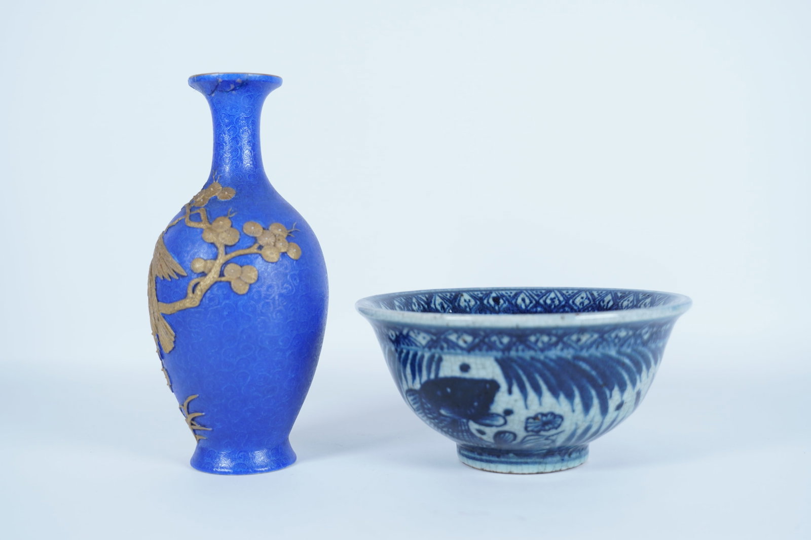 2 Chinese fine porcelains: 2 Chinese fine porcelains, one of the vase top has repair. Please see detail photos. Largest H: 3.5" x W: 7."