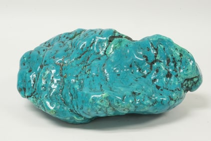 A large turquoise boulder