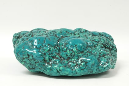 A large turquoise boulder