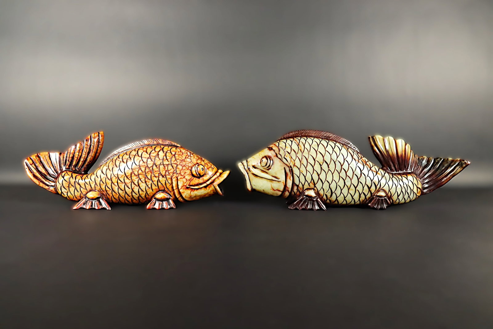 2 Chinese carved fish: 2 Chinese carved fish, condition selling it as is, please refer to detail photos. All sales are final. Largest H: 3.75" x L: 17.25."