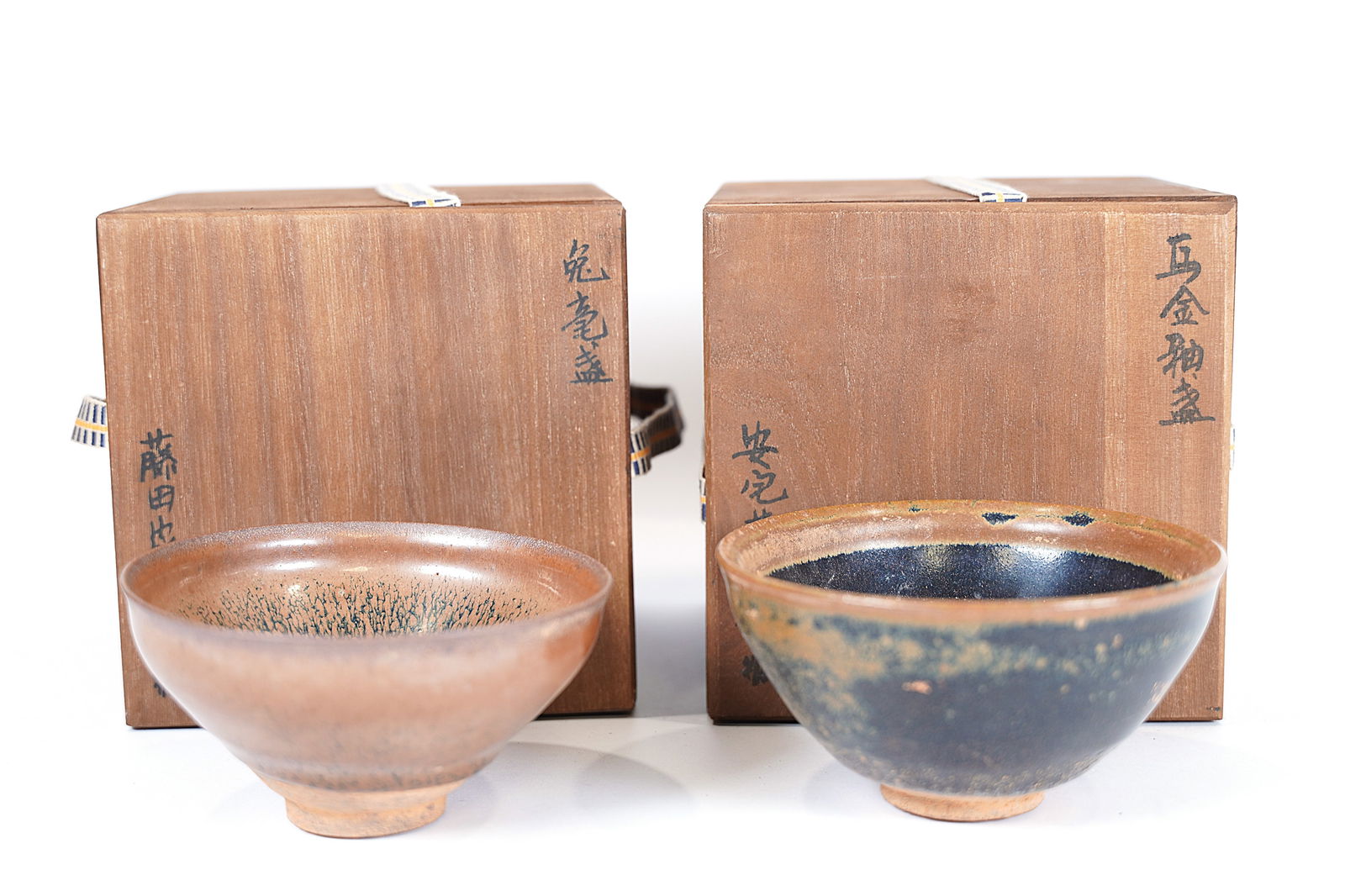2 Chinese tea bowls: 2 Chinese fine tea bowls, with wooden box. Largest H: 2.75" x W: 5."