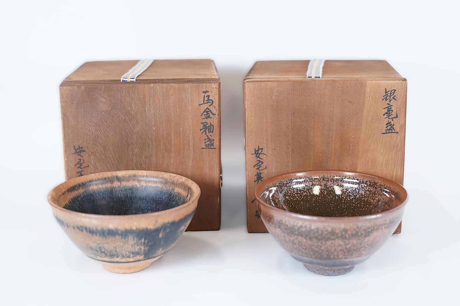 2 Chinese tea bowls: 2 Chinese fine tea bowls, with wooden box. Largest H: 3" x W: 5."