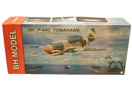 A large RC aiplane in original box. P-40C Tomahawk, condition selling it as is.