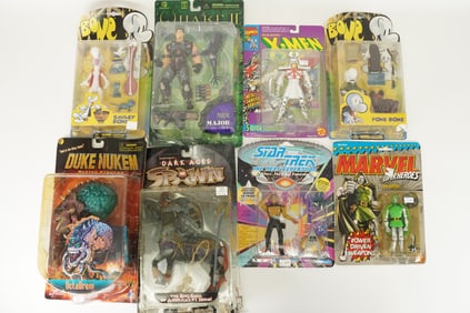 Lots vintage action figure in original packaging. Largest H: 12" x W: 9."