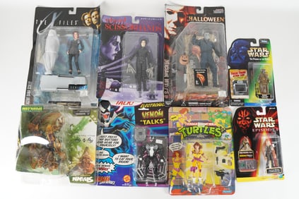 Lots vintage action figure in original packaging. Largest H: 13" x W: 12."