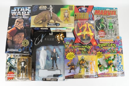 Lots vintage action figure in original box. Largest H: 13" x W: 6.5."