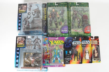 Lots vintage action figure in original box. Largest H: 12" x W: 10."