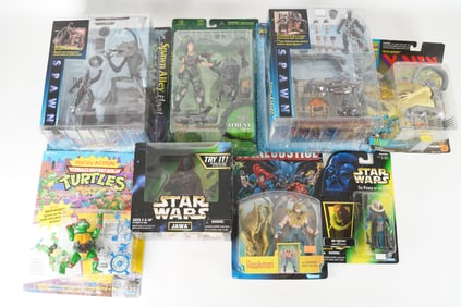 Lots vintage action figures in original box. Largest H: 12" x W: 10."
