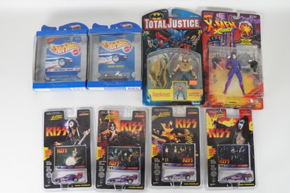 Lots vintage action figures in original box. Largest H: 8" x W: 7."