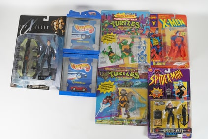 Lots vintage action figures in original box. Largest H: 11.25" x W: 9."