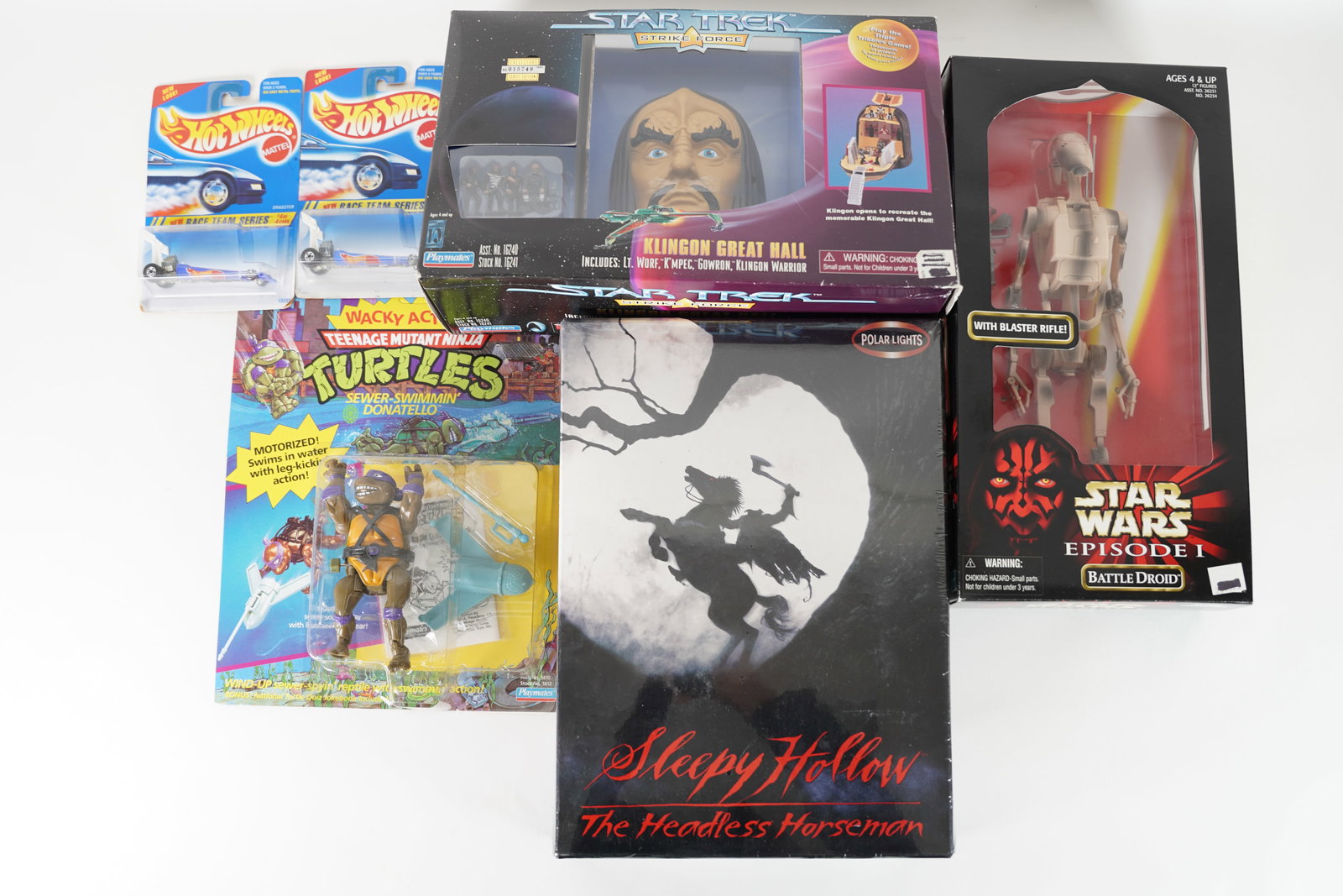 Lots vintage action figures in original box. Largest H: 12.5" x W: 3." (1 of 8)