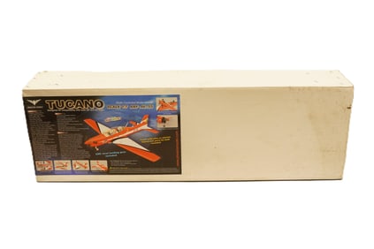 A large RC airplane, Tucano, in original box. Condition selling it as is.