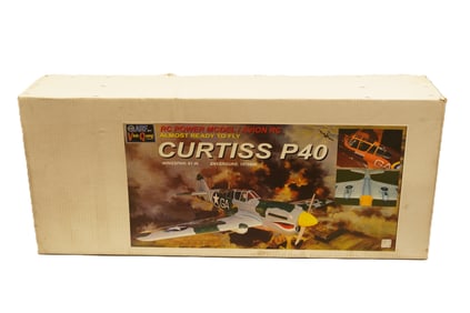 A large RC airplane, Curtiss P40, in original box. Condition selling it as is.