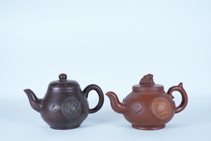 2 Chinese fine clay teapot. Largest H: 4.3" x W: 6.5."