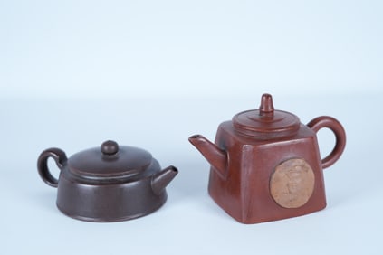 2 Chinese fine clay teapot. Largest H: 4.2" x W: 6."