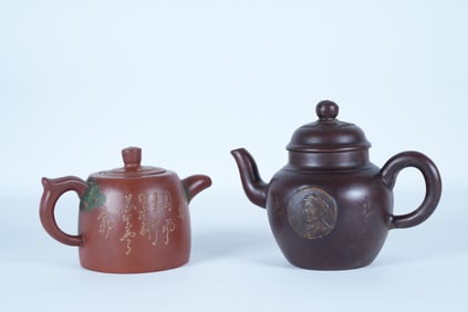 2 Chinese fine clay teapot. Largest H: 5" x W: 7."