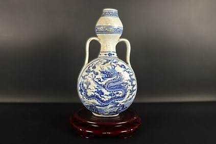 Chinese blue and white flask vase. H: 10" x W: 5.5."