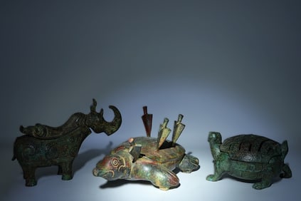 Lots Chinese bronze vessels. Largest H: 4.5" x W: 9."