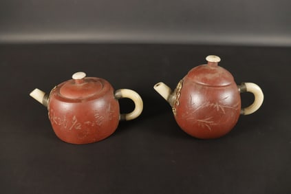 Lots Chinese clay teapots. Largest H: 4.4" x W: 6."