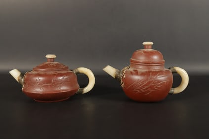 Lots Chinese clay teapots. Largest H: 4" x W: 6."