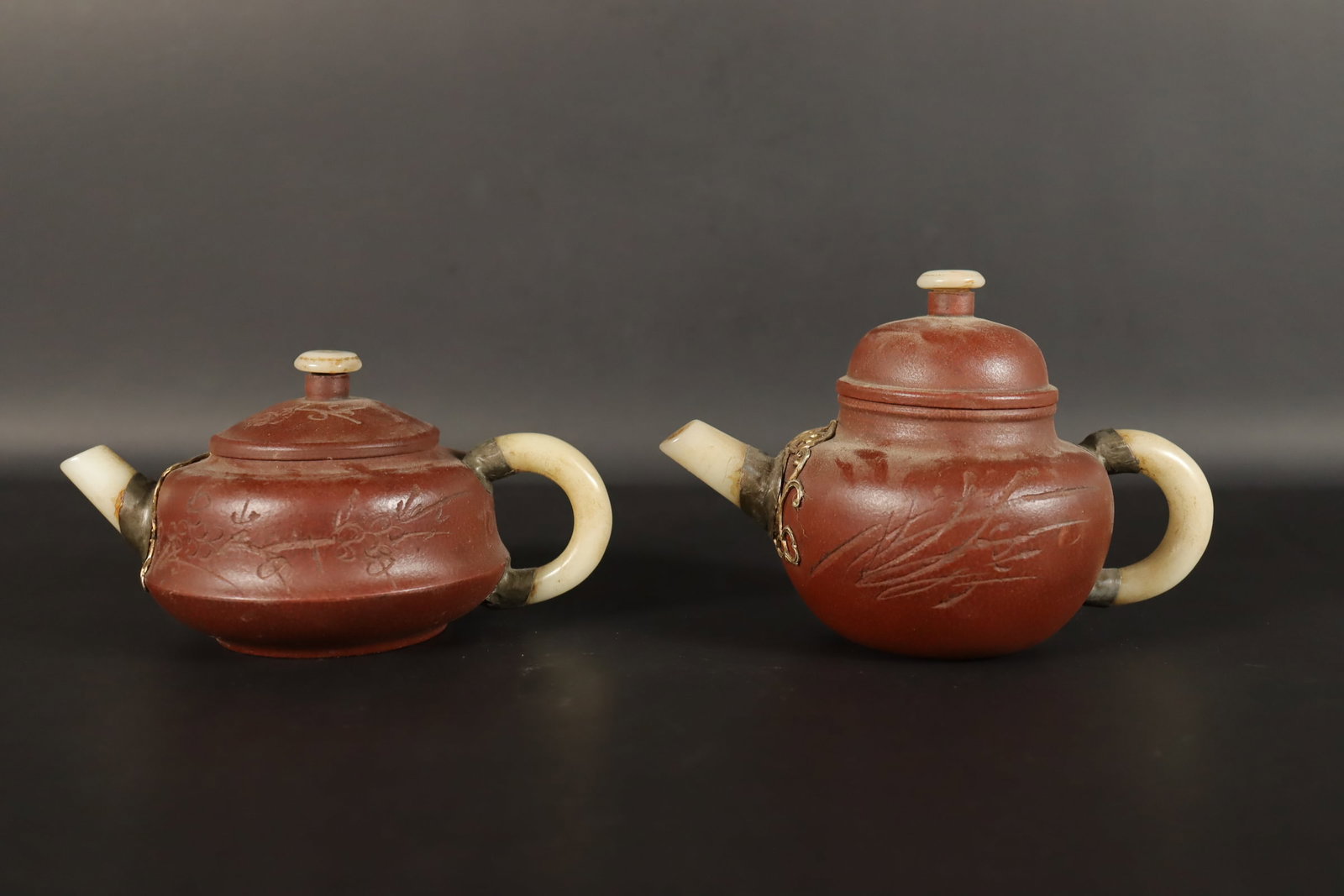 Lots Chinese clay teapots. Largest H: 4" x W: 6." (1 of 7)